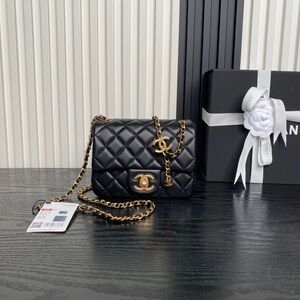 CHANEL Black Quilted Lambskin Mini Flap Bag with Gold Hardware